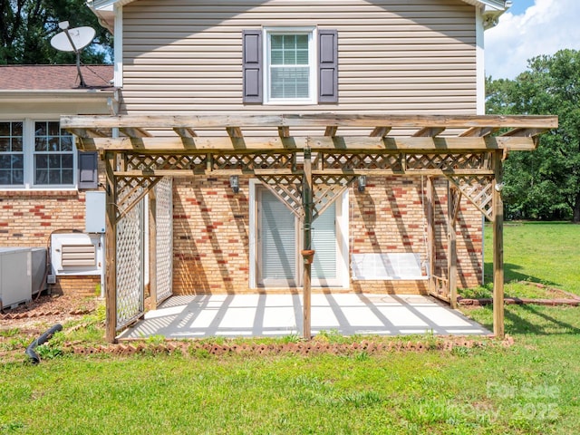 409 Ridge Rd, Clover, SC 29710 - back of property featuring brick siding, a yard, a patio area, and a pergola