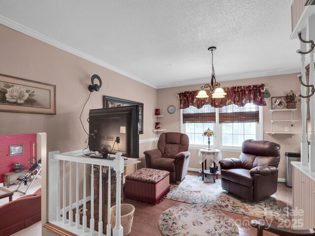 409 Ridge Rd, Clover, SC 29710 - living room featuring crown molding, a chandelier, a textured ceiling, and wood finished floors