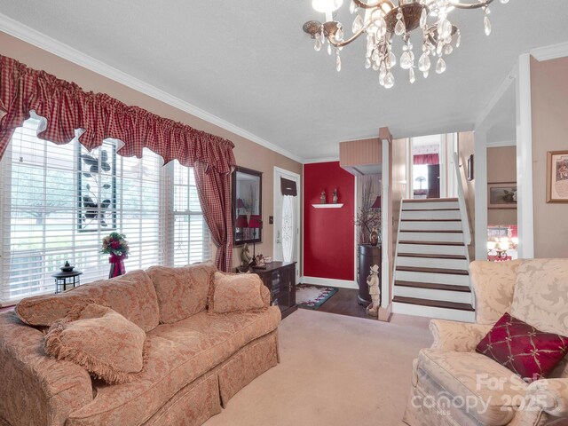 409 Ridge Rd, Clover, SC 29710 - living room featuring crown molding, a chandelier, stairway, and wood finished floors