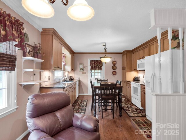 409 Ridge Rd, Clover, SC 29710 - kitchen featuring white appliances, a sink, decorative backsplash, dark wood-style flooring, and open shelves
