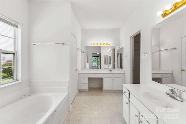 13832 Queenswater Ln, Charlotte, NC 28273 - bathroom with a bath, two vanities, and marble finish floors