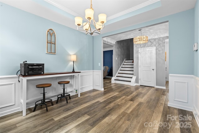 5059 Fenwick Ct, Lancaster, SC 29720 - dining room with a chandelier, wainscoting, stairway, a decorative wall, and wood finished floors