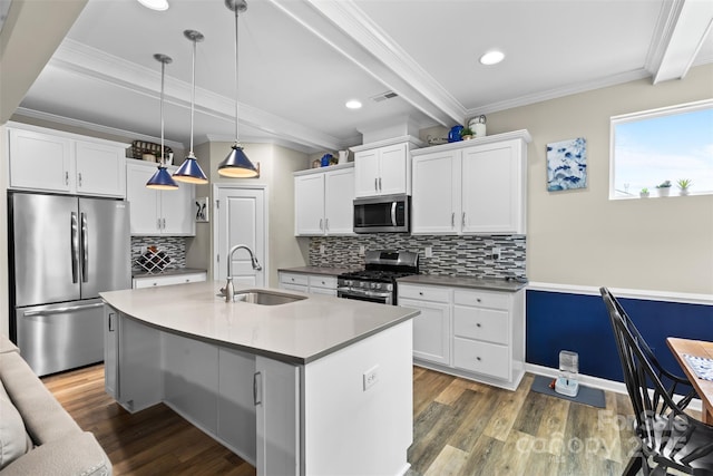 5059 Fenwick Ct, Lancaster, SC 29720 - kitchen featuring appliances with stainless steel finishes, beam ceiling, ornamental molding, dark wood-style flooring, and hanging light fixtures