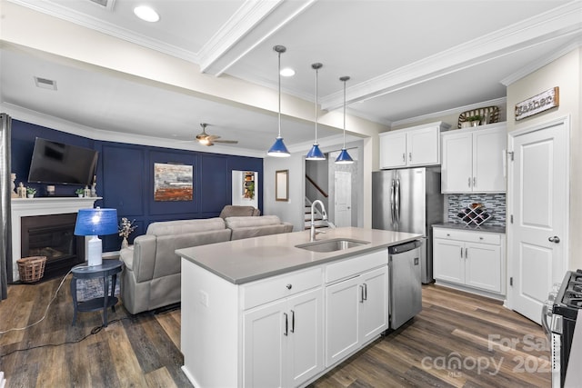 5059 Fenwick Ct, Lancaster, SC 29720 - kitchen featuring appliances with stainless steel finishes, dark wood-type flooring, decorative light fixtures, crown molding, and open floor plan