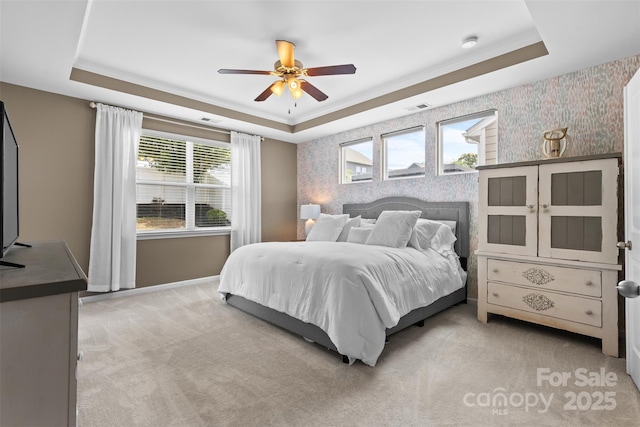5059 Fenwick Ct, Lancaster, SC 29720 - bedroom featuring wallpapered walls, a tray ceiling, light colored carpet, multiple windows, and a ceiling fan