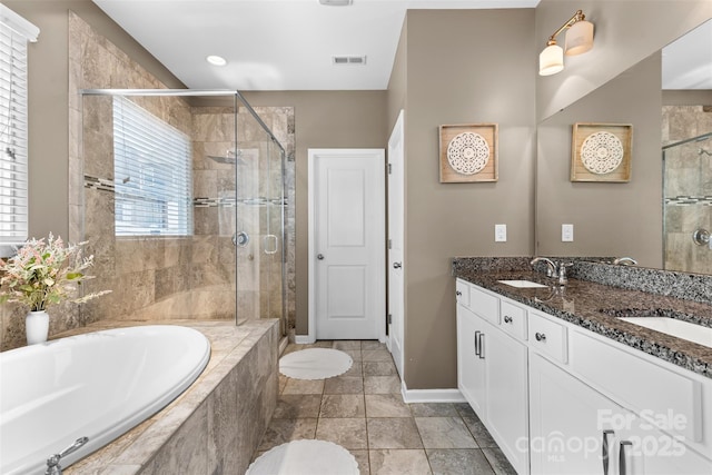 5059 Fenwick Ct, Lancaster, SC 29720 - bathroom with a bath, a shower stall, and double vanity