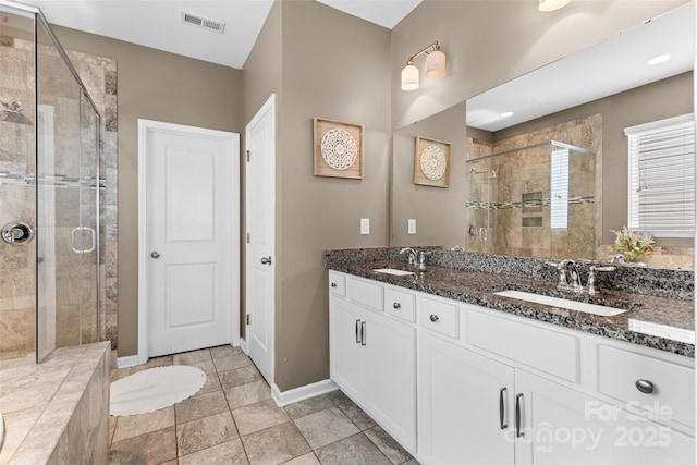 5059 Fenwick Ct, Lancaster, SC 29720 - bathroom featuring a stall shower and double vanity
