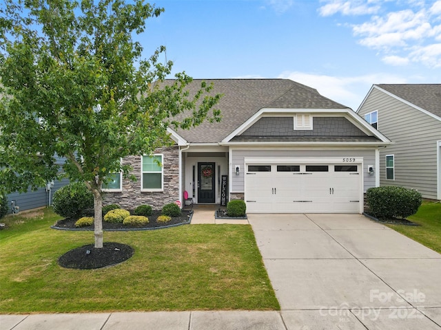 5059 Fenwick Ct, Lancaster, SC 29720 - craftsman house featuring an attached garage, a front yard, concrete driveway, and a shingled roof