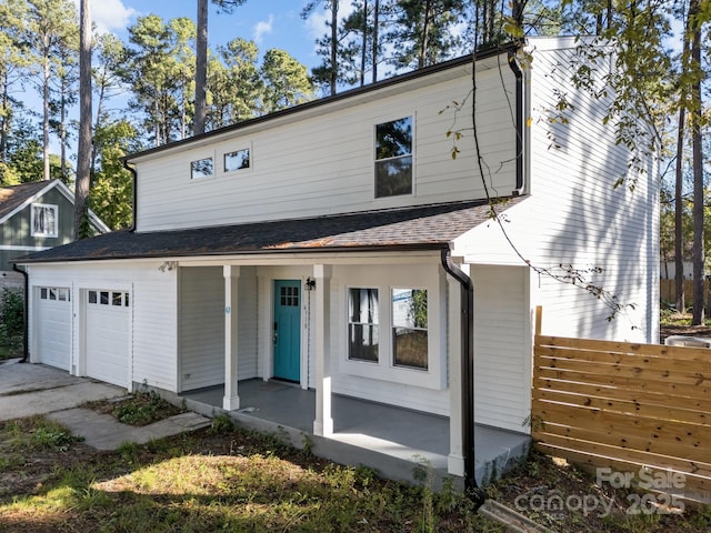 4918 Tyne Dr, Durham, NC 27703 - view of front of property with covered porch, concrete driveway, and a shingled roof