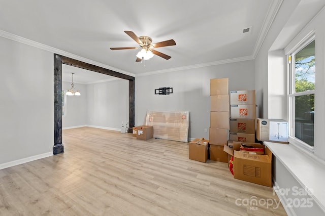 4918 Tyne Dr, Durham, NC 27703 - spare room with crown molding, healthy amount of natural light, a ceiling fan, wood finished floors, and baseboards