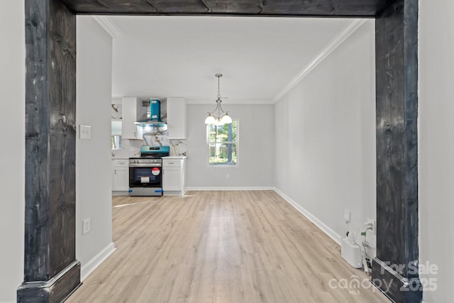 4918 Tyne Dr, Durham, NC 27703 - unfurnished dining area with light wood-style floors, ornamental molding, baseboards, and a chandelier