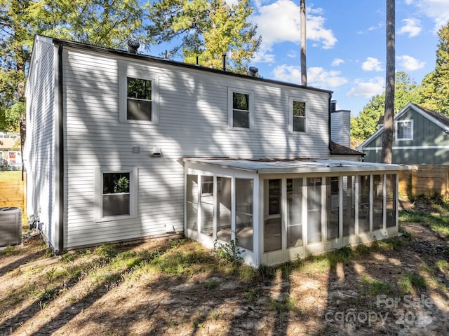 4918 Tyne Dr, Durham, NC 27703 - rear view of house with a sunroom and cooling unit
