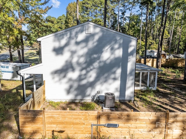 4918 Tyne Dr, Durham, NC 27703 - view of home's exterior with a sunroom and central air condition unit