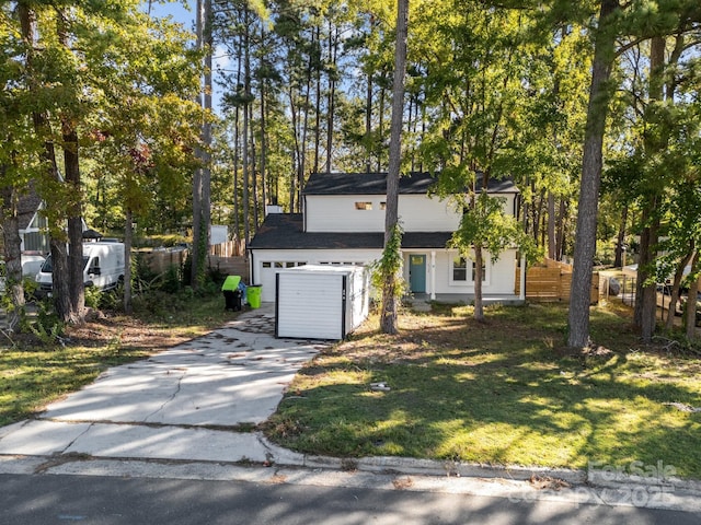4918 Tyne Dr, Durham, NC 27703 - view of front facade with driveway, an attached garage, and roof with shingles