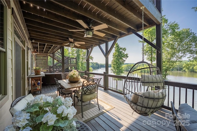 5888 Wood Duck Way, Catawba, NC 28609 - wooden terrace featuring stairway, a water view, a ceiling fan, and outdoor dining area
