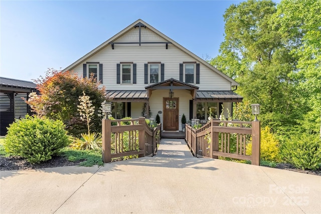 5888 Wood Duck Way, Catawba, NC 28609 - view of front of property featuring covered porch, a standing seam roof, and a metal roof
