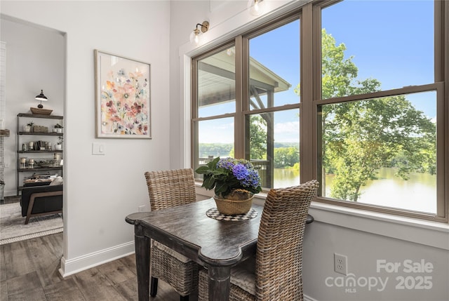 5888 Wood Duck Way, Catawba, NC 28609 - dining space with dark wood-style flooring, plenty of natural light, and a water view