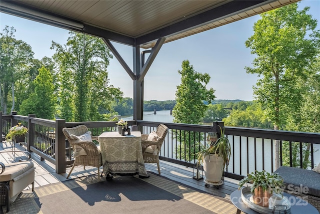 5888 Wood Duck Way, Catawba, NC 28609 - wooden deck with outdoor dining space and a water view