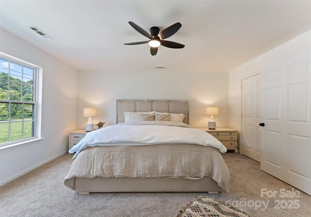 5229 Tarrywood Ln, Charlotte, NC 28205 - bedroom with light carpet, ceiling fan, and baseboards
