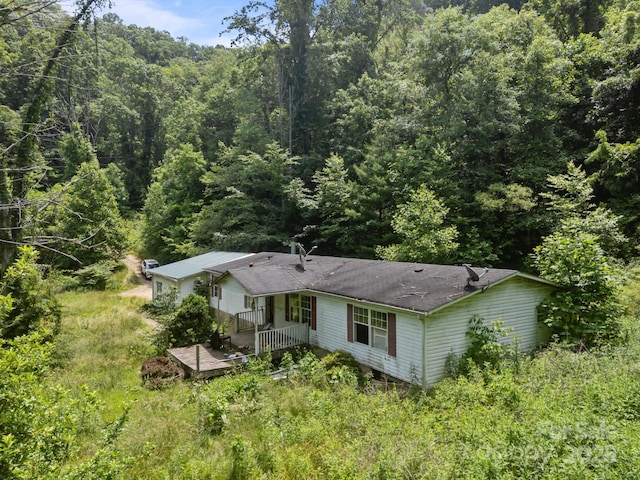 99 Bridges Cove Rd, Leicester, NC 28748 - aerial view of property and surrounding area with a heavily wooded area