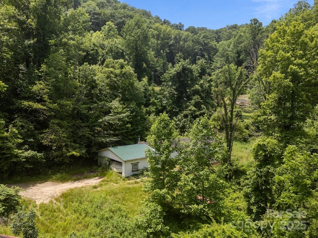 99 Bridges Cove Rd, Leicester, NC 28748 - aerial view of property and surrounding area featuring a heavily wooded area