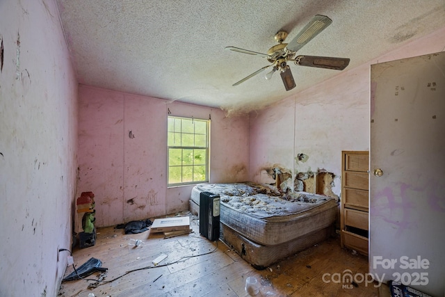 99 Bridges Cove Rd, Leicester, NC 28748 - bedroom with a textured ceiling and ceiling fan