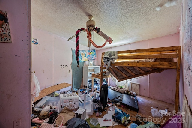 99 Bridges Cove Rd, Leicester, NC 28748 - unfurnished bedroom featuring a textured ceiling, wood finished floors, and ceiling fan