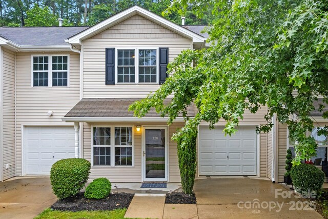 120 Alpine Ridge Dr, Asheville, NC 28803 - townhome / multi-family property featuring concrete driveway, a garage, and roof with shingles