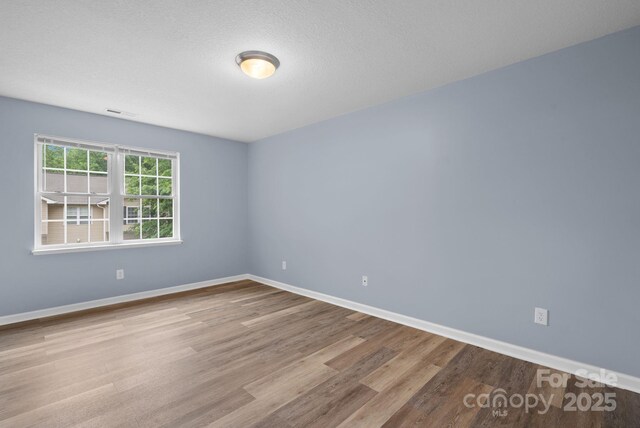 120 Alpine Ridge Dr, Asheville, NC 28803 - unfurnished room featuring wood finished floors and baseboards