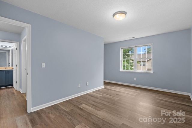 120 Alpine Ridge Dr, Asheville, NC 28803 - spare room featuring wood finished floors and baseboards