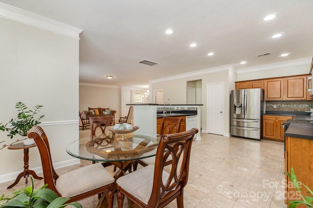 13622 Stringfellow Ln, Charlotte, NC 28278 - dining room with crown molding and recessed lighting