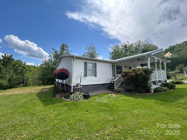 121 J F Morris Dr, Waynesville, NC 28786 - view of home's exterior featuring a yard, crawl space, covered porch, and a ceiling fan