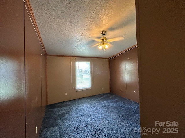 121 J F Morris Dr, Waynesville, NC 28786 - empty room with a textured ceiling, carpet, a ceiling fan, and ornamental molding