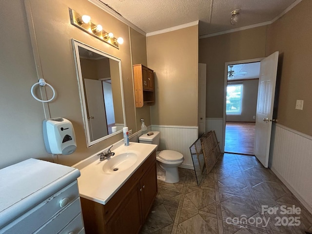 121 J F Morris Dr, Waynesville, NC 28786 - bathroom featuring toilet, a wainscoted wall, vanity, ornamental molding, and a textured ceiling