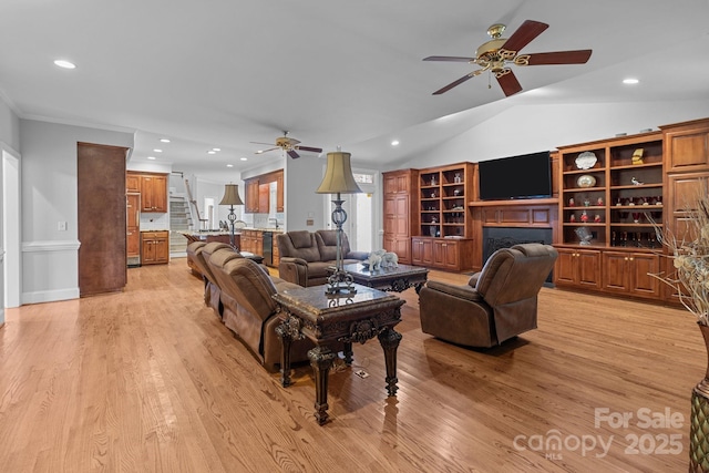 654 9th St N, Albemarle, NC 28001 - living room featuring a ceiling fan, light wood finished floors, recessed lighting, a fireplace, and lofted ceiling