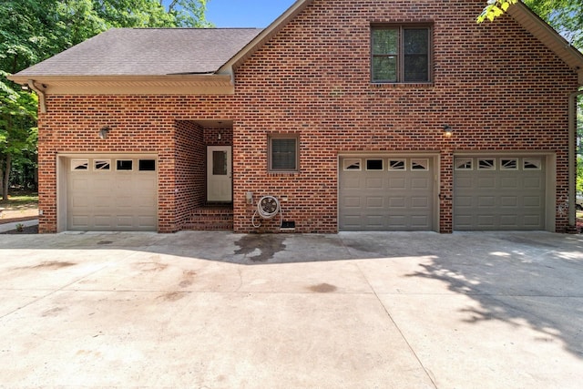 654 9th St N, Albemarle, NC 28001 - traditional-style house with concrete driveway, brick siding, a garage, and roof with shingles