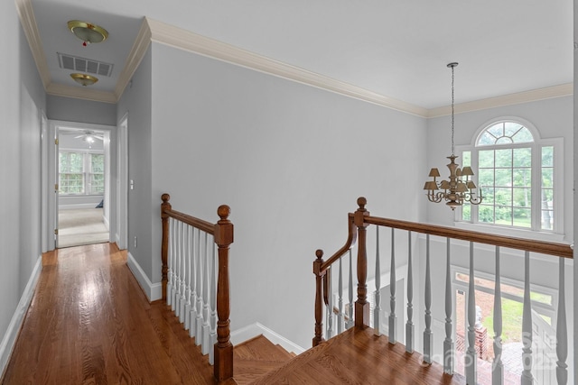 654 9th St N, Albemarle, NC 28001 - corridor featuring an upstairs landing, plenty of natural light, wood finished floors, and crown molding
