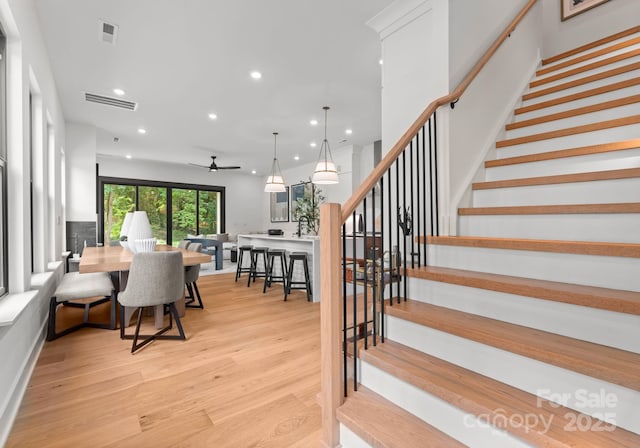 4117 Sarah Dr, Charlotte, NC 28217 - staircase featuring recessed lighting, ceiling fan, and wood finished floors
