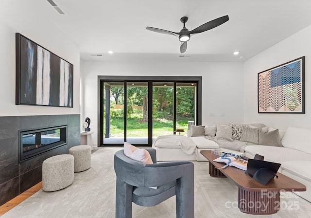 4117 Sarah Dr, Charlotte, NC 28217 - living room featuring a ceiling fan, a fireplace, and recessed lighting