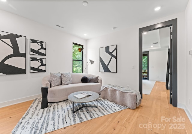 4117 Sarah Dr, Charlotte, NC 28217 - living area featuring light wood finished floors and recessed lighting