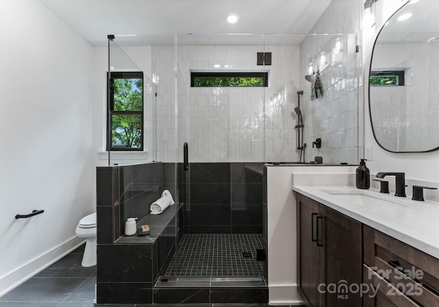 4117 Sarah Dr, Charlotte, NC 28217 - bathroom featuring vanity, a stall shower, tile patterned floors, and recessed lighting