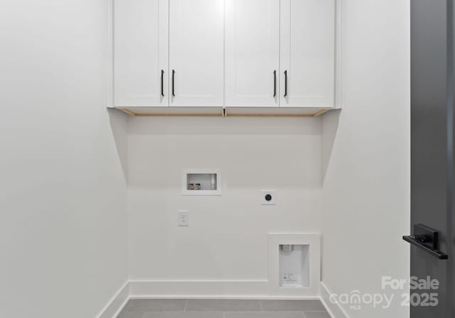 4117 Sarah Dr, Charlotte, NC 28217 - laundry area with cabinet space, electric dryer hookup, hookup for a washing machine, and tile patterned flooring