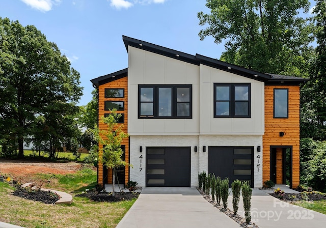4117 Sarah Dr, Charlotte, NC 28217 - contemporary house with an attached garage and concrete driveway