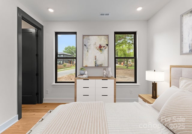 4117 Sarah Dr, Charlotte, NC 28217 - bedroom featuring light wood-style flooring and recessed lighting