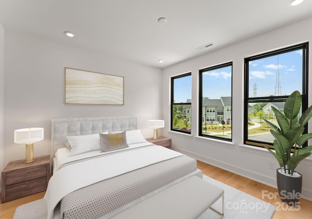 4117 Sarah Dr, Charlotte, NC 28217 - bedroom featuring light wood finished floors and recessed lighting