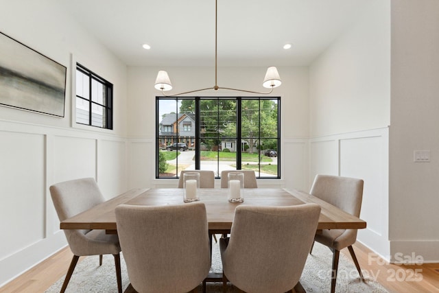 408 Ideal Way, Charlotte, NC 28203 - dining space featuring a decorative wall, healthy amount of natural light, a wainscoted wall, light wood finished floors, and recessed lighting