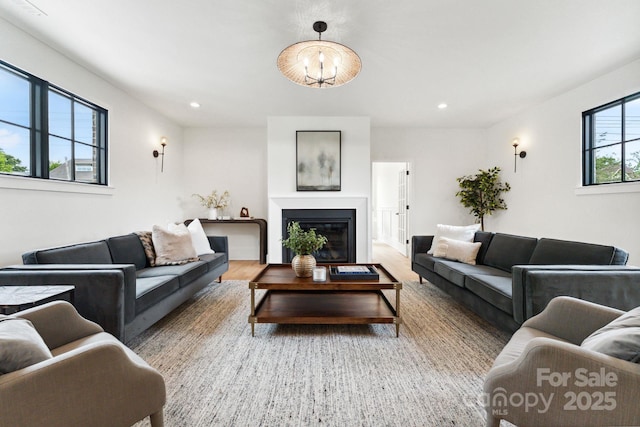 408 Ideal Way, Charlotte, NC 28203 - living area featuring recessed lighting, wood finished floors, and a glass covered fireplace