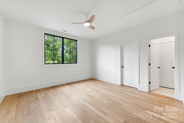 408 Ideal Way, Charlotte, NC 28203 - unfurnished room featuring attic access, light wood-type flooring, and ceiling fan