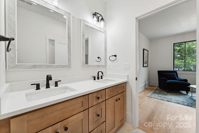 408 Ideal Way, Charlotte, NC 28203 - full bathroom featuring double vanity and wood finished floors