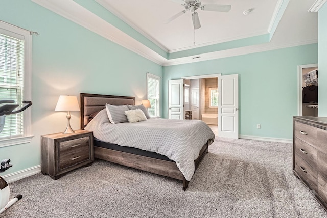 18732 Coachmans Trce, Cornelius, NC 28031 - carpeted bedroom featuring a raised ceiling, crown molding, ensuite bath, and a ceiling fan